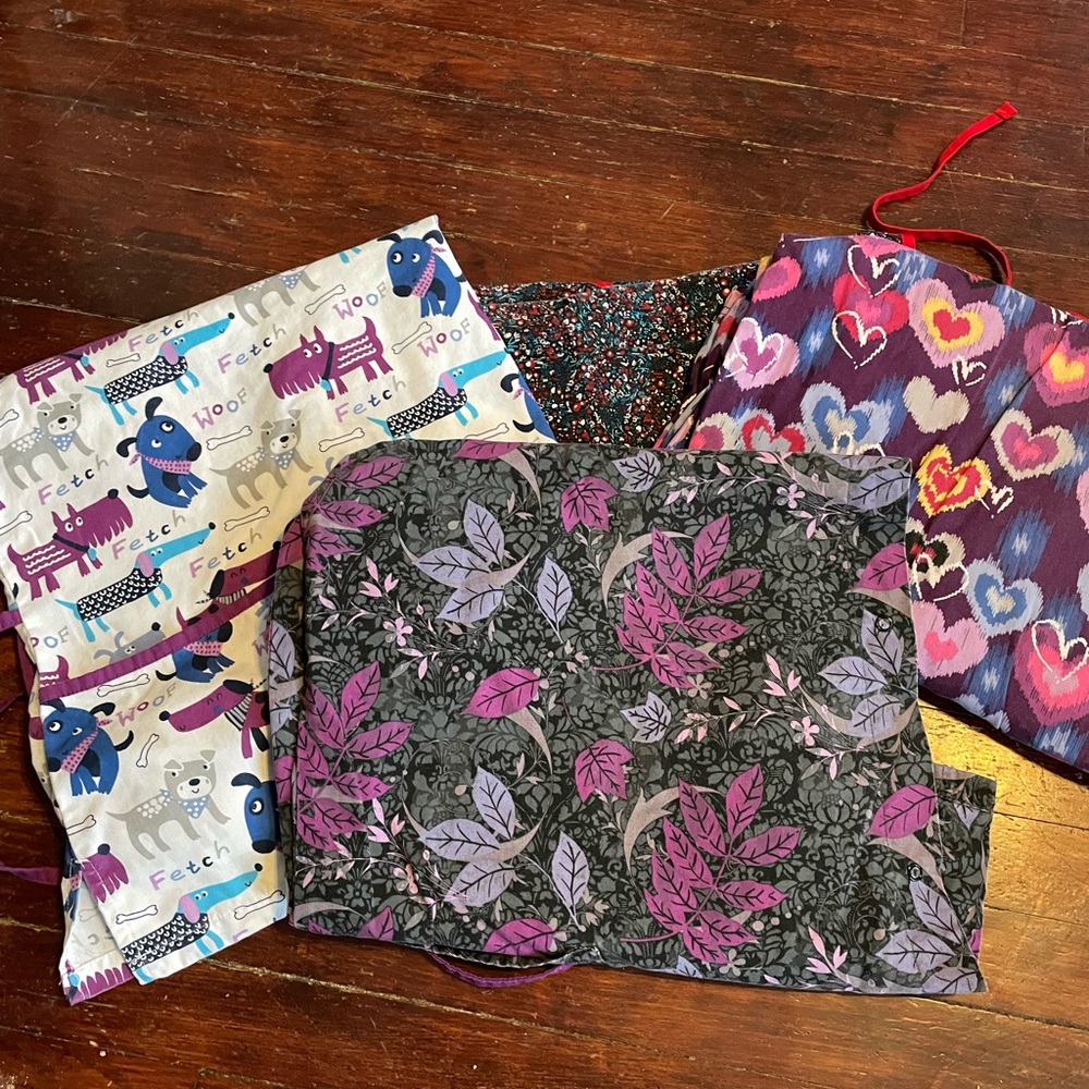 Size 3X nearly new scrub jackets and 1 scrub top. Brand UA scrubs
